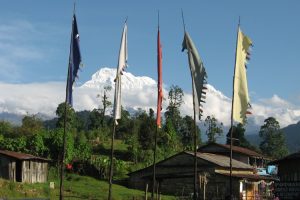 Mountain scenery and prayer flags on the Annapurna Sanctuary Trek. Image by A Gallop