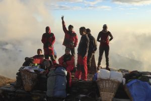 Porters in the Kori Sunrise. Image by N Morgan