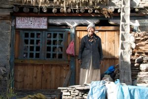 Local outside a Village house, Naar Phu. Image by J Davies